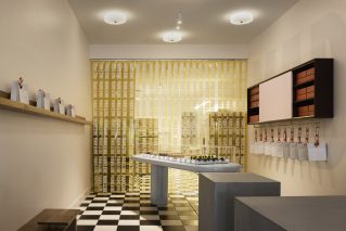 "Interior of Madeleine de Proust with elegant design and neatly arranged pastries on display."