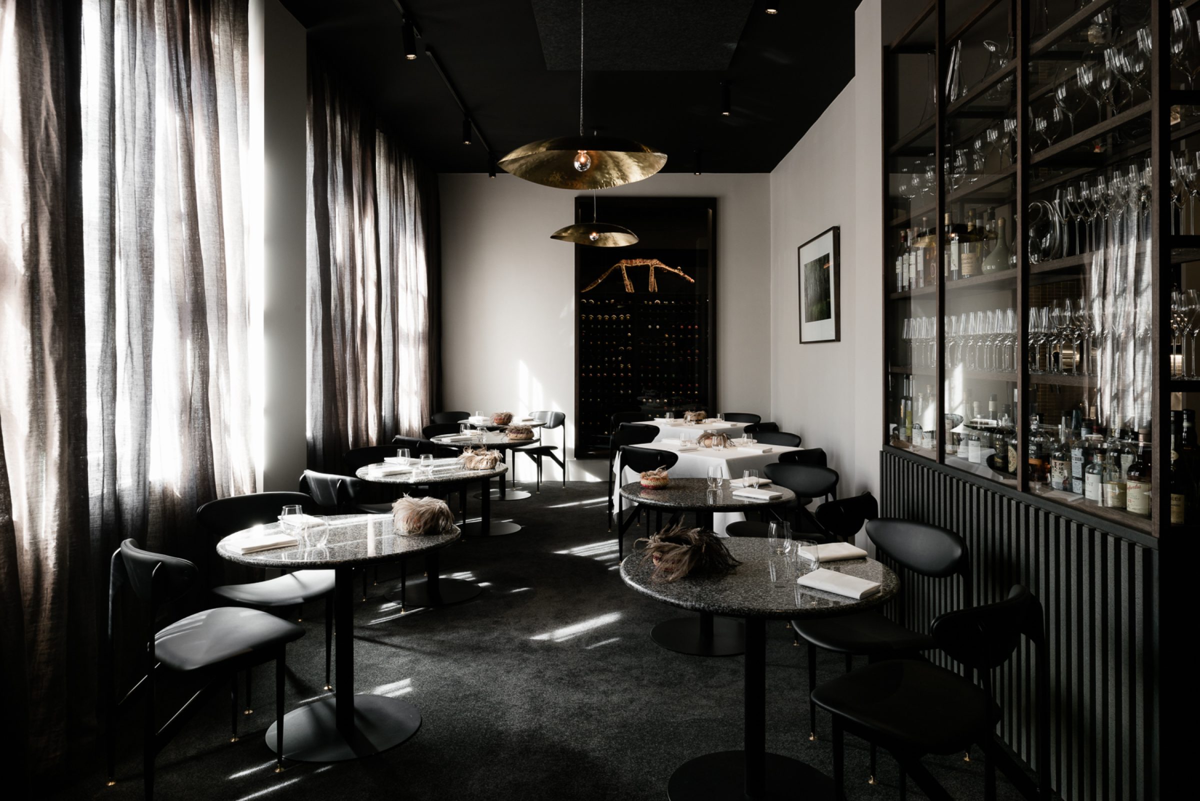Modern dining room interior with elegant tables and chairs from the Attica series.