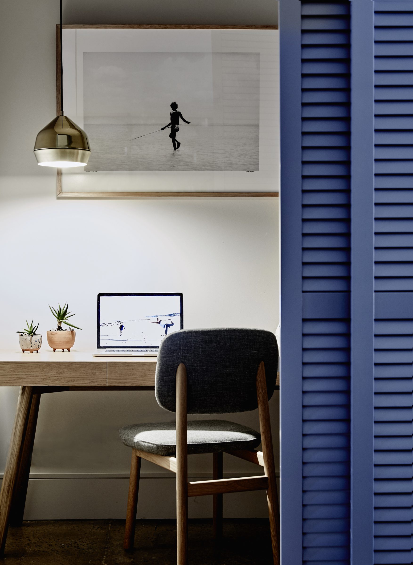 Modern home office with desk, chair, and laptop in "Jardan, Brisbane" interior design.