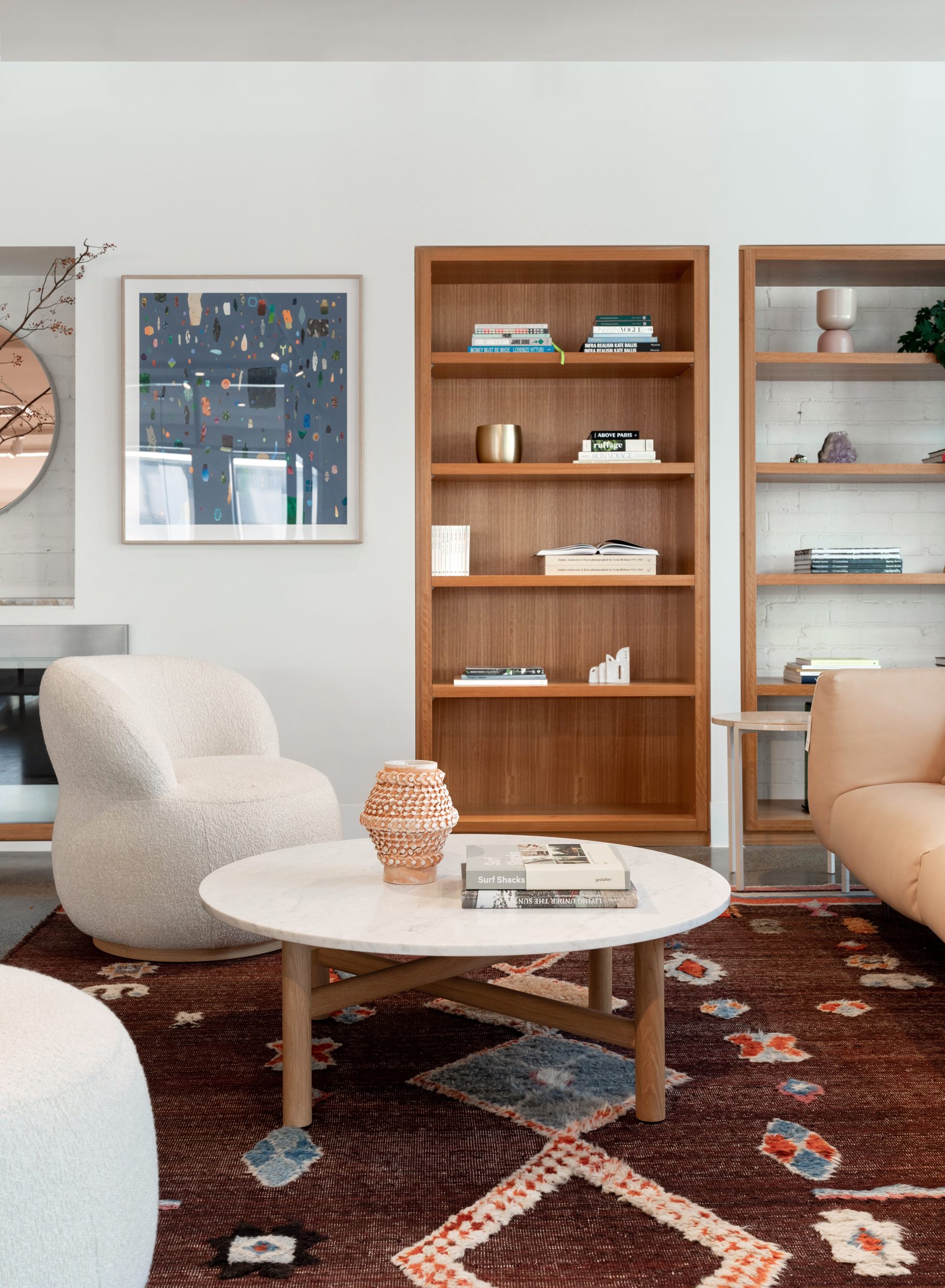 Modern living room interior from "Jardan, Melbourne" featuring cozy seating and a stylish bookshelf.