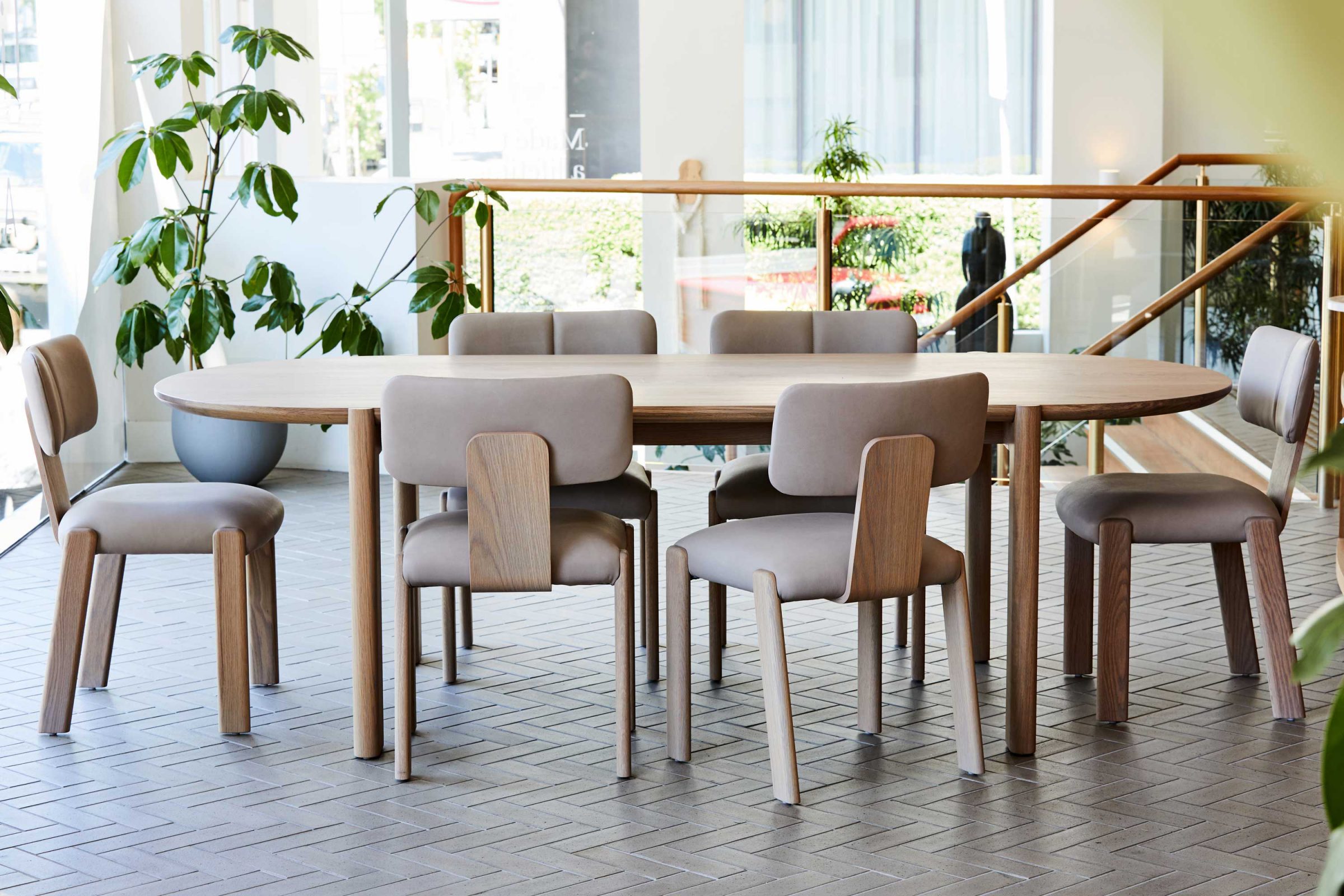 Modern dining set with wooden table and chairs in Jardan, Melbourne showroom.