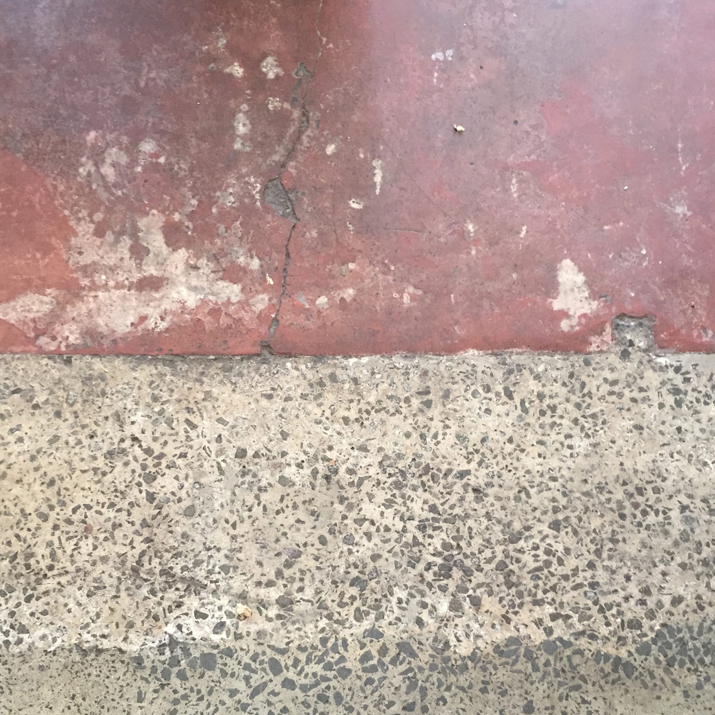 Cracked red and gray textured surface from Marion.
