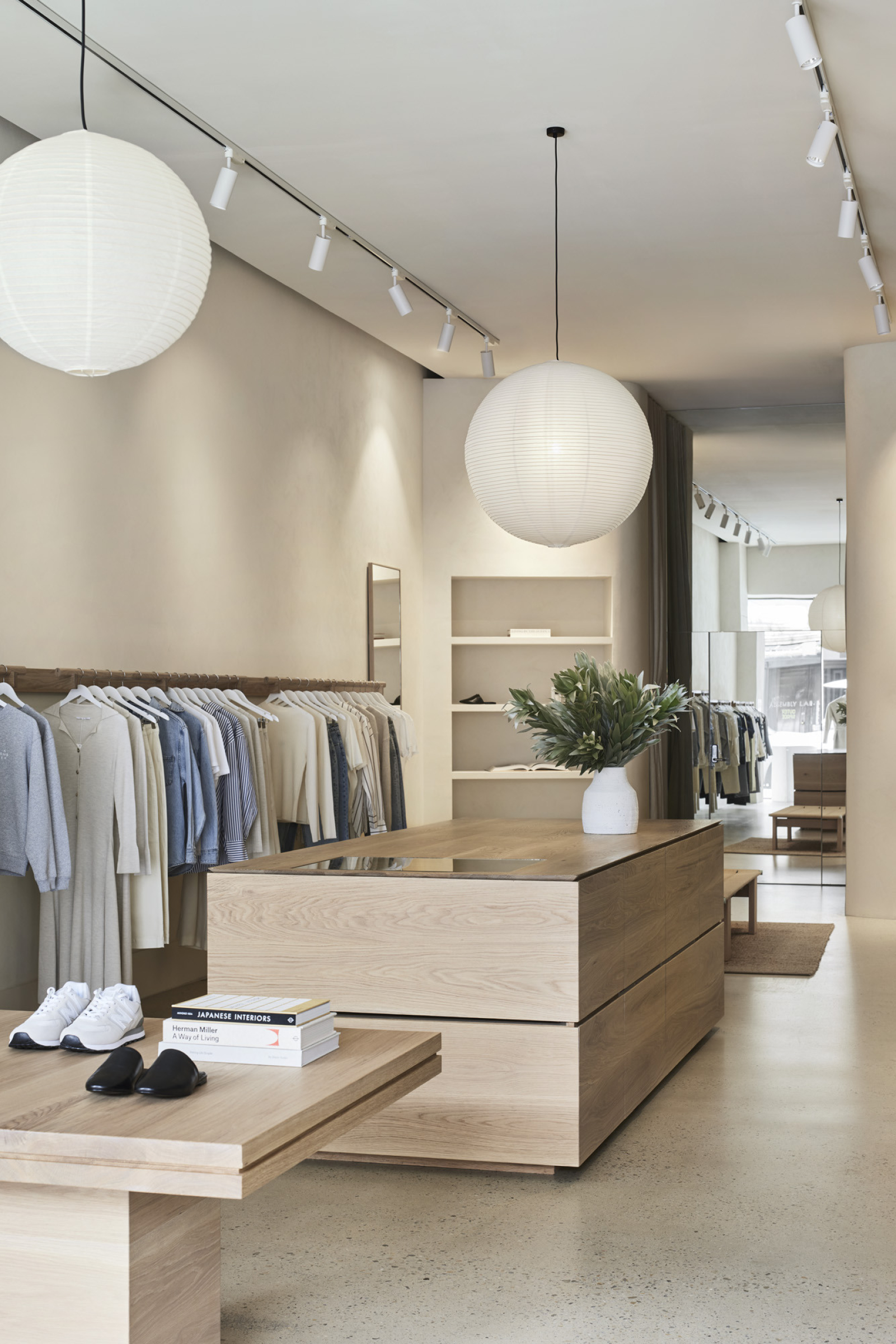 Modern retail interior at Assembly Label, Adelaide with minimalist design and neutral tones.
