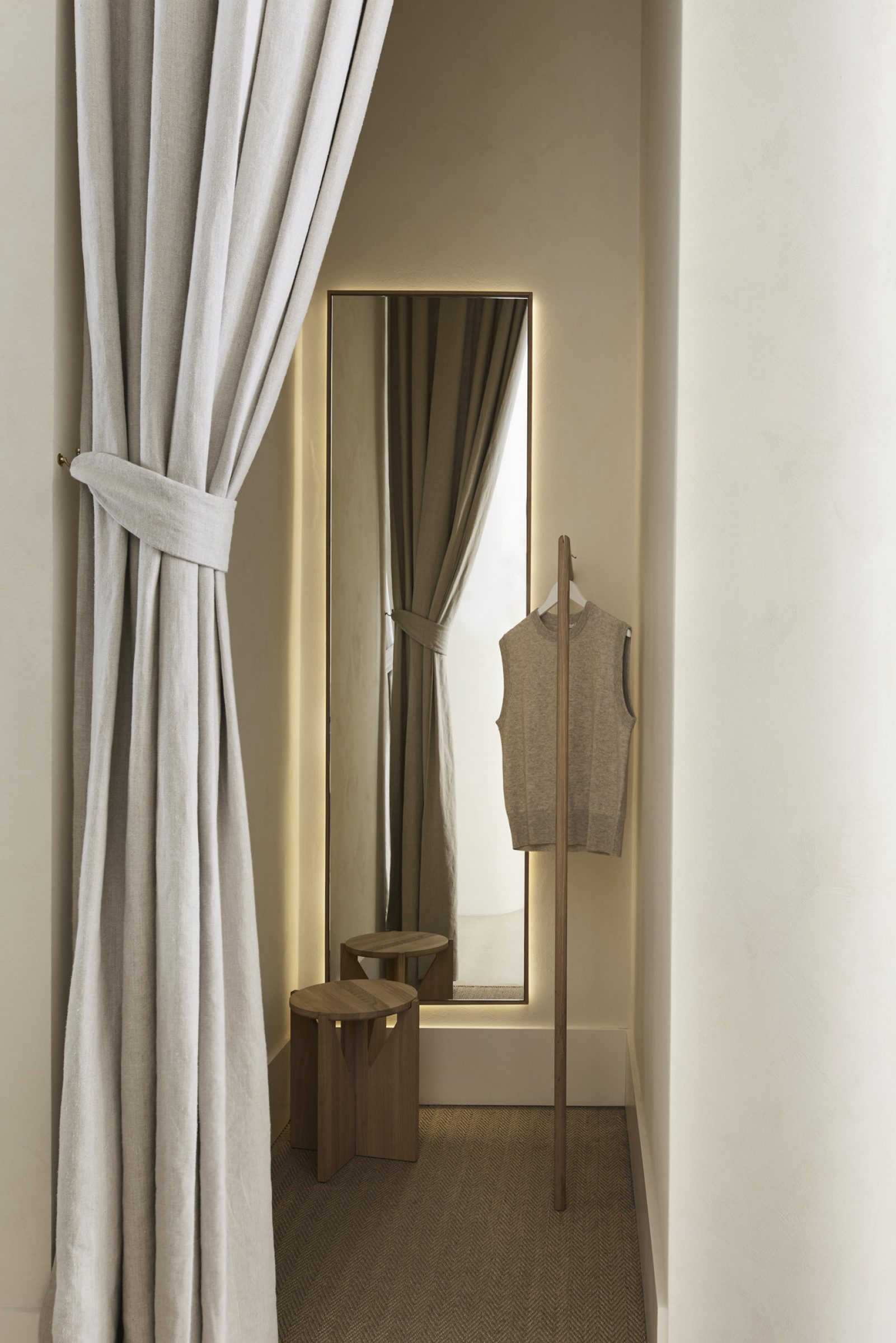 Minimalist dressing room with beige curtains and mirror from Assembly Label, Adelaide.