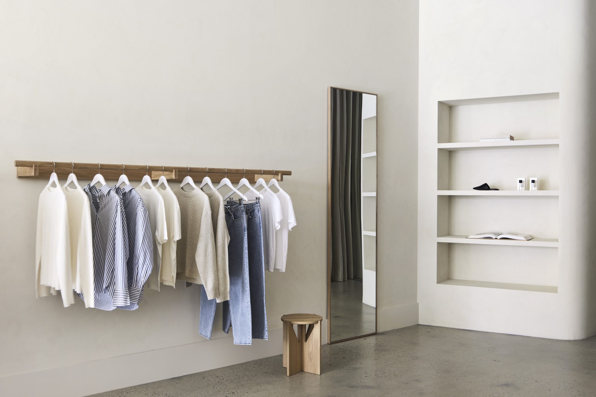 Minimalist clothing display in Assembly Label, Adelaide, featuring neutral tones and modern design elements.