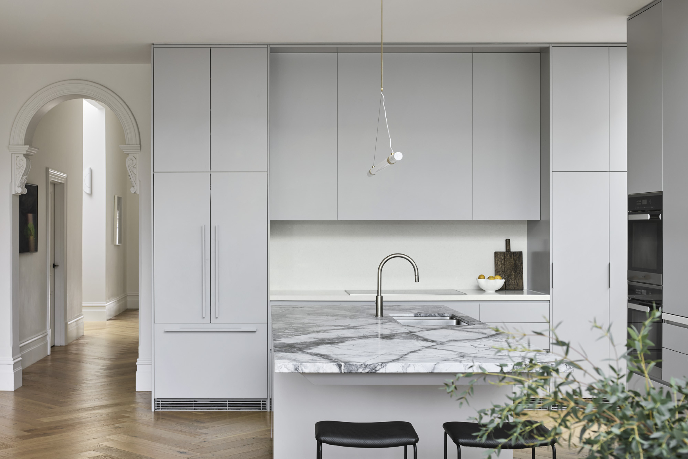 Modern kitchen interior with marble countertops and minimalist design in Day House.