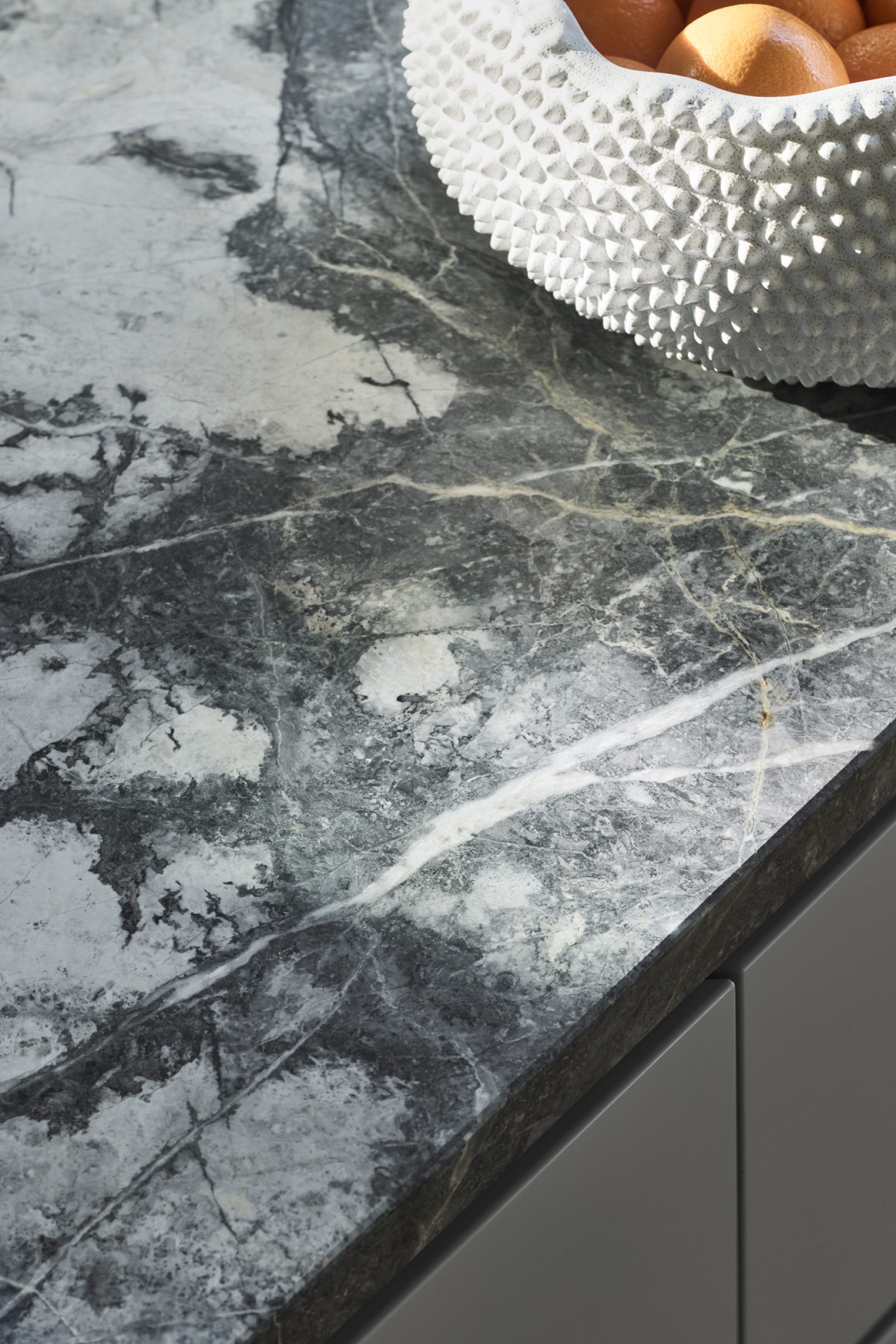 Textured ceramic bowl on a marble countertop from Day House.
