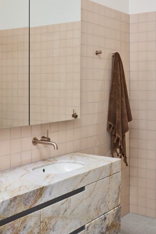 Modern bathroom design with marble sink and beige tiles from Day House.