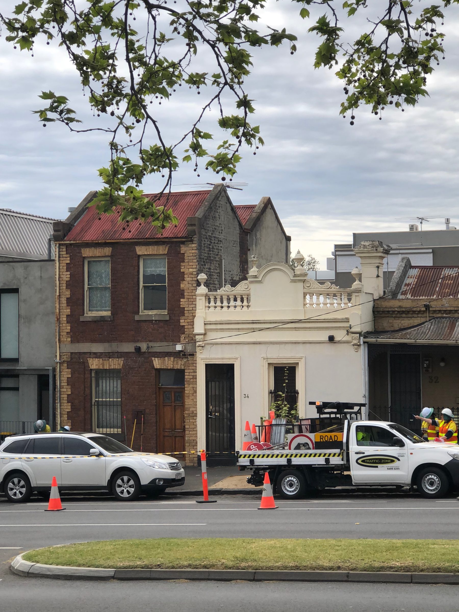 Street view with construction scene and vehicles, part of Escargot initiative.