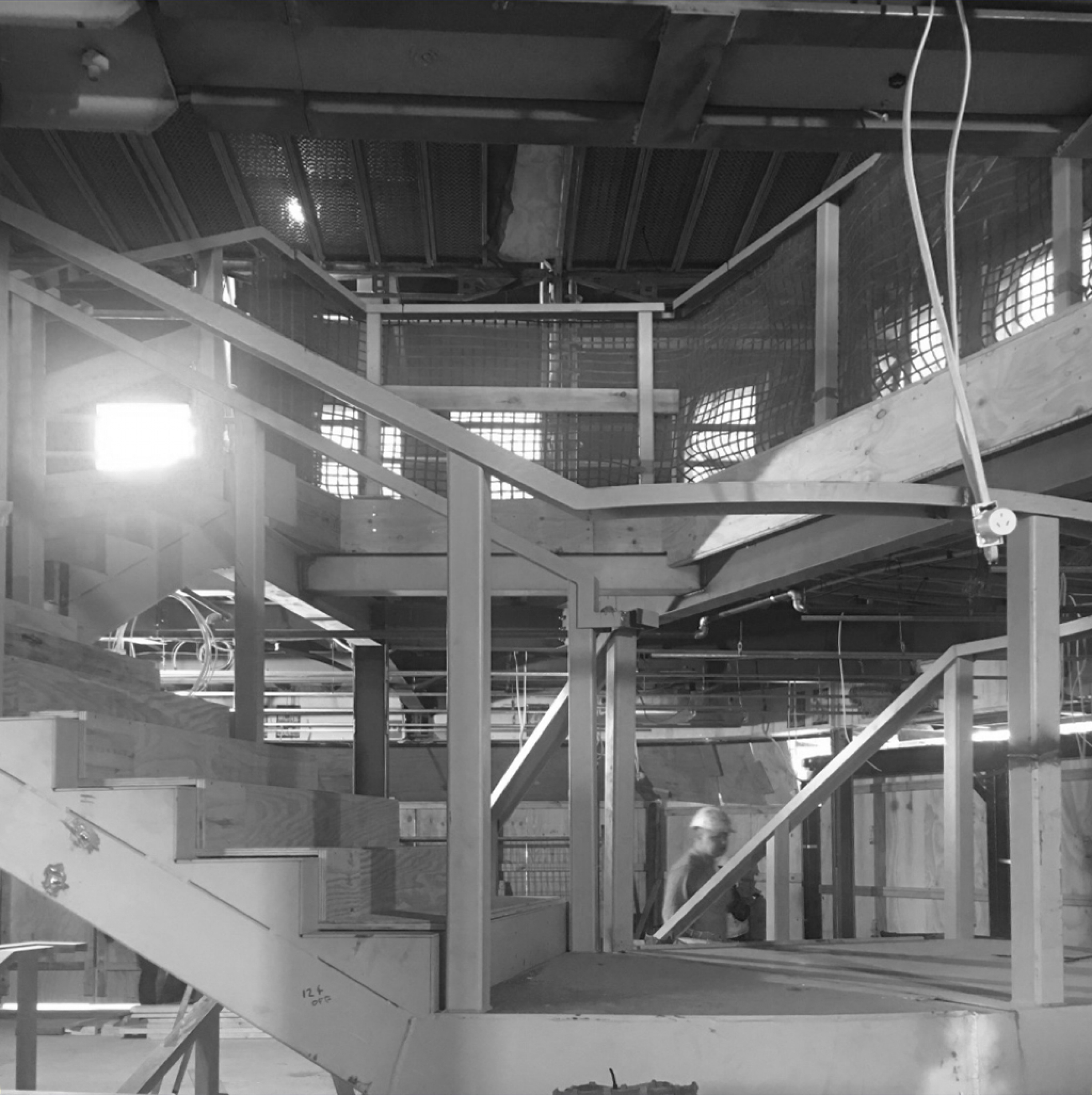 Construction site interior with metal and wood structures, part of "Jardan, Sydney".