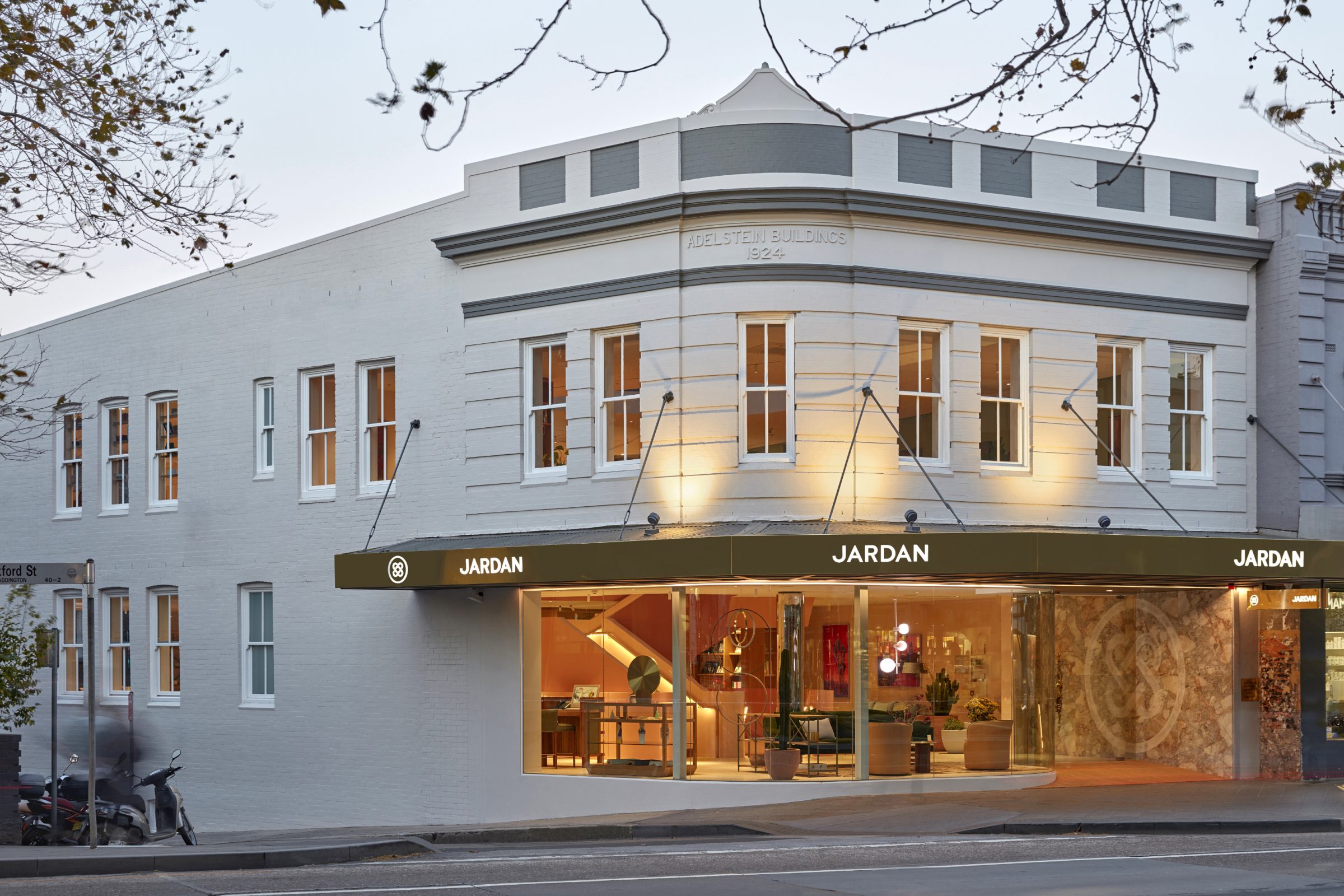 Jardan Sydney storefront in a historic building with illuminated modern interior design elements.
