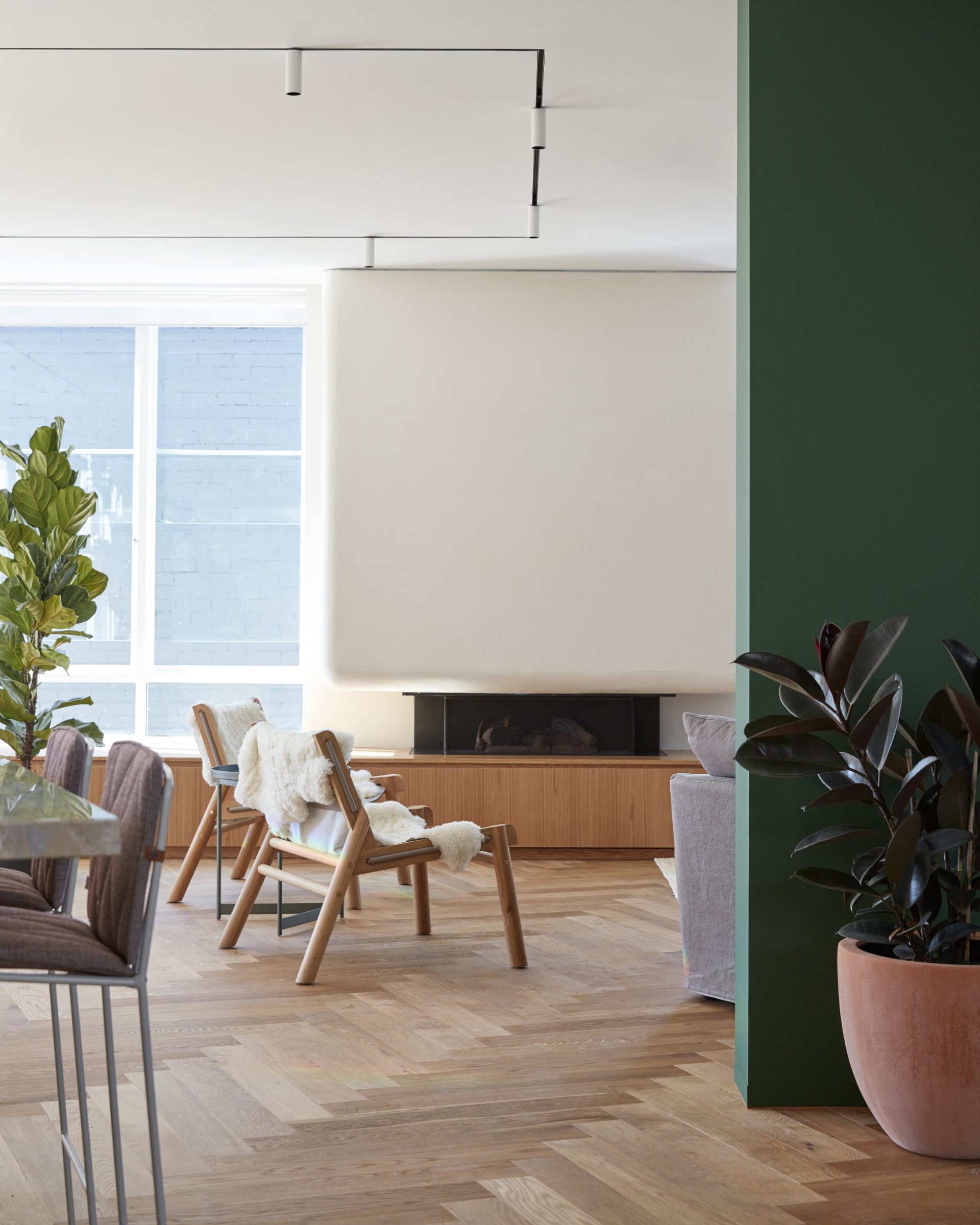 Modern interior design featuring wooden flooring and green accents in Jardan Sydney.