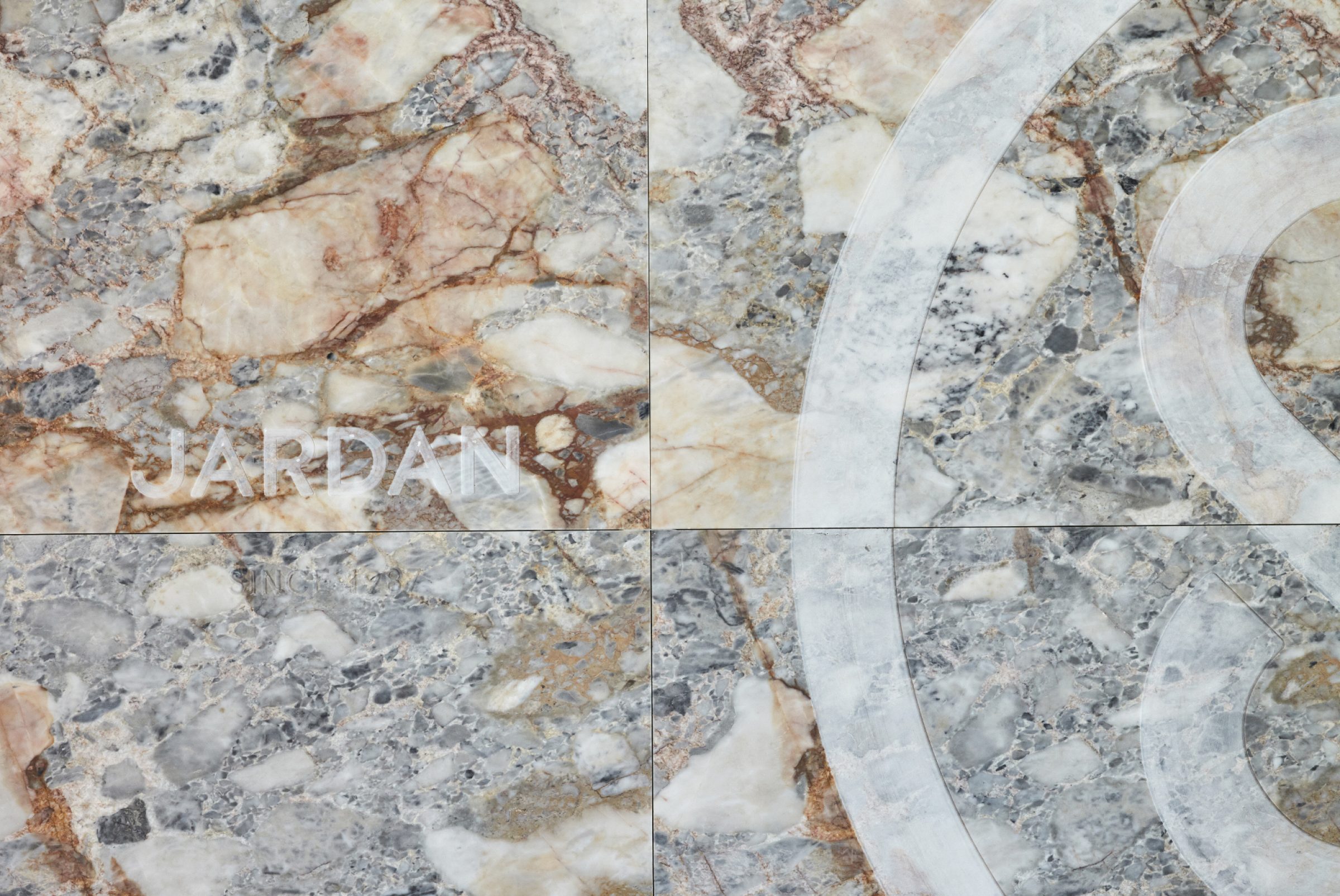 Marble texture with the word Jardan, part of the Jardan Sydney collection.