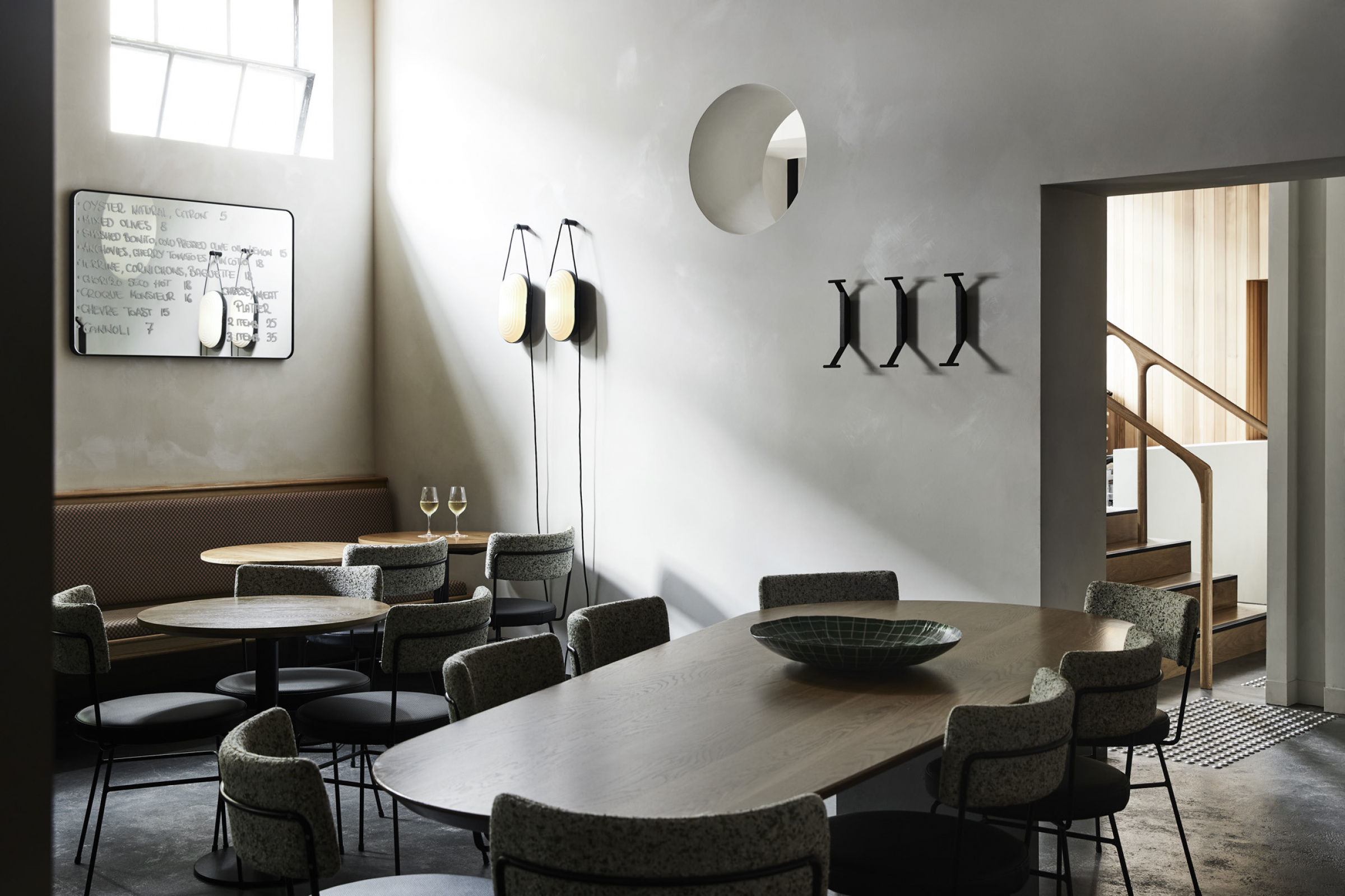 Modern dining area with elegant decor and wine glasses from Little Prince Wine.