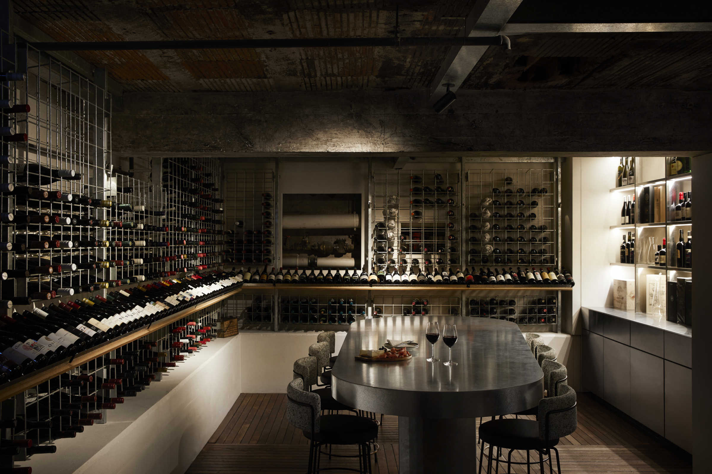 Wine cellar with tasting table and racks for Little Prince Wine collection.