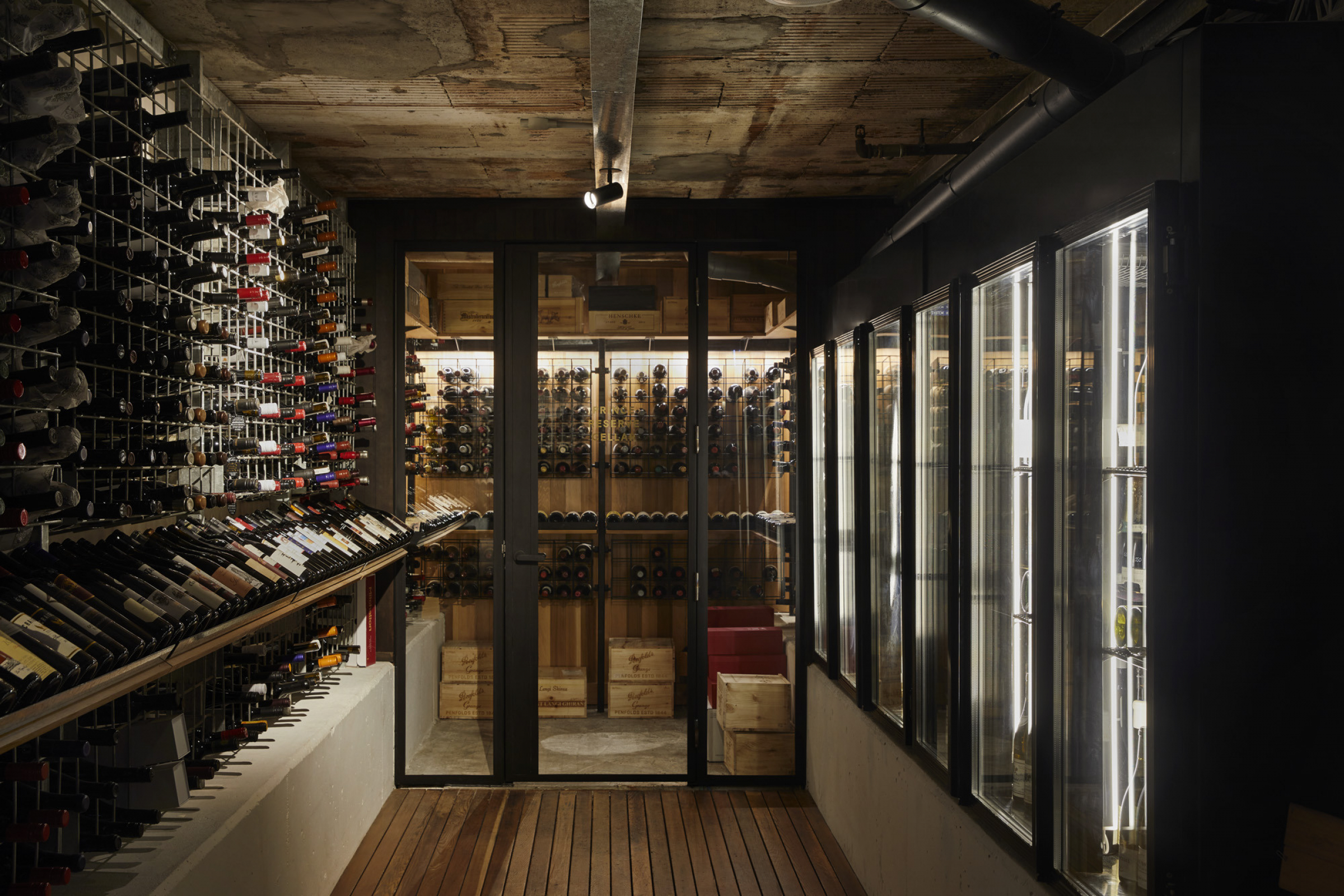 Wine cellar filled with bottles for Little Prince Wine project, showcasing elegant storage design.