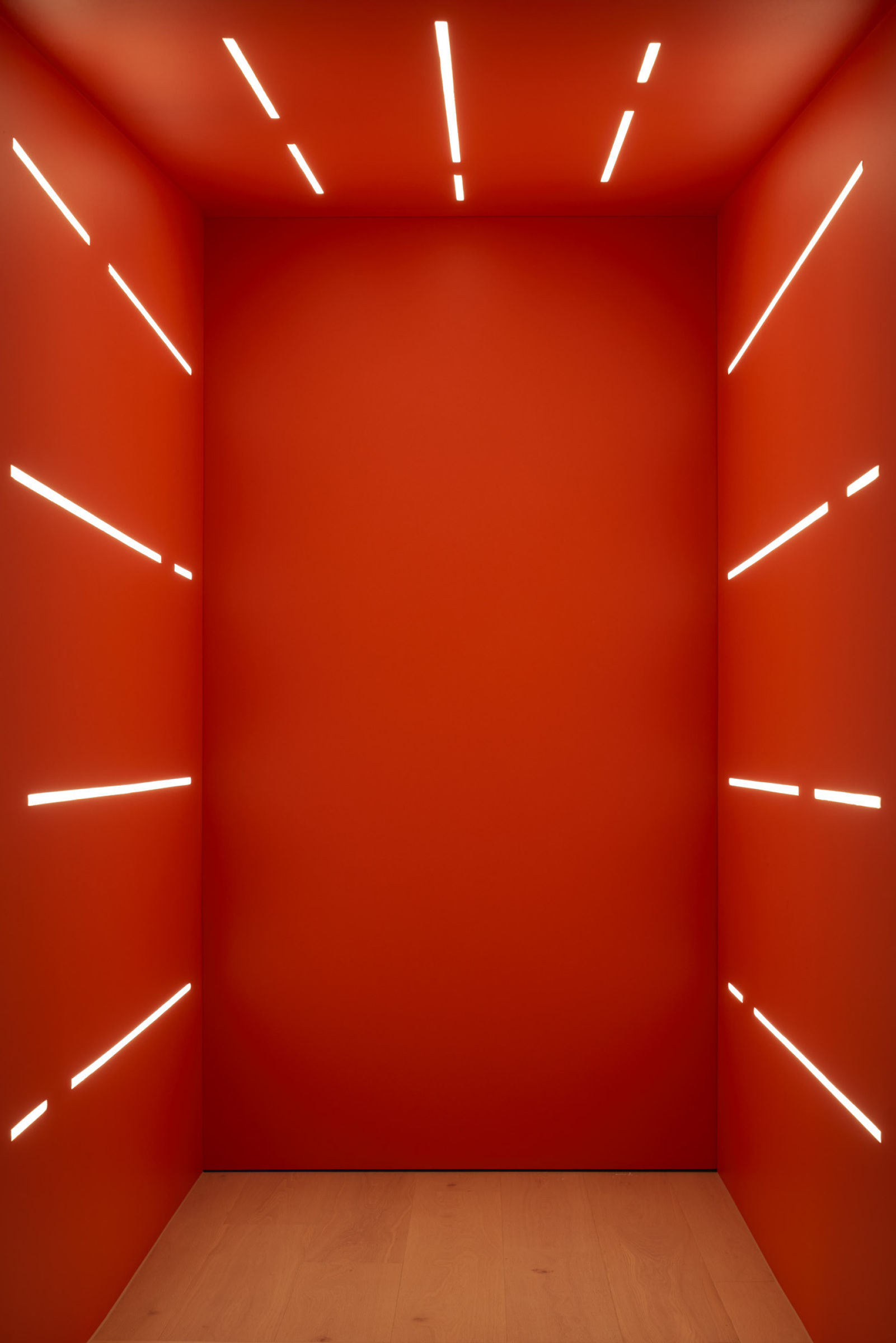 Red room with linear white lights, part of Lux-Fx.