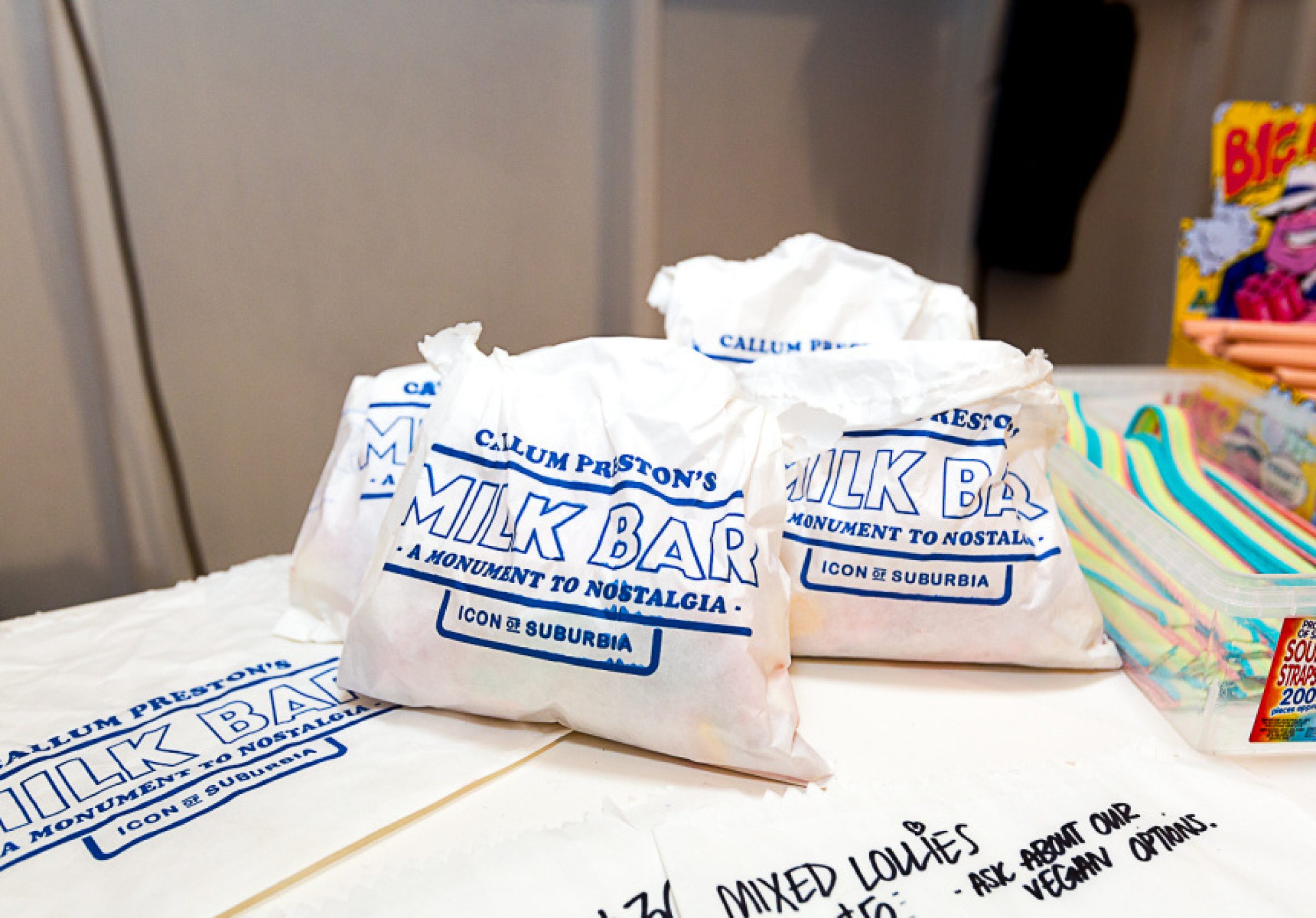 Milk Bar paper bags evoke nostalgia, part of "Madeleine de Proust" by Callum Preston.