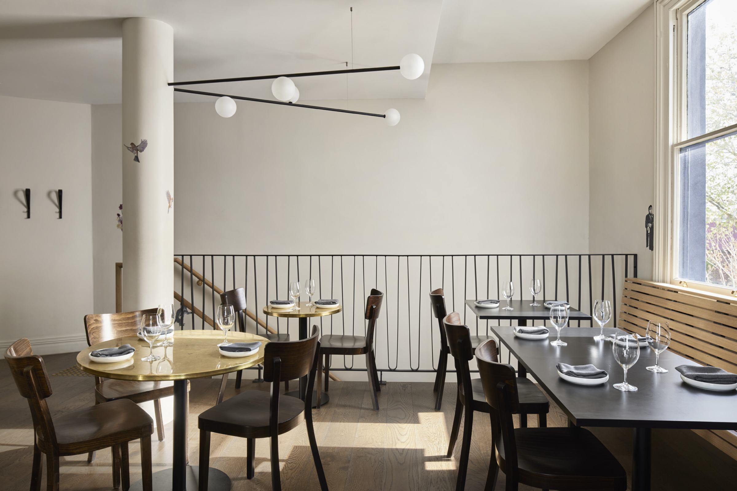 Modern restaurant interior with elegant table settings, part of "One Trick Pony" series.