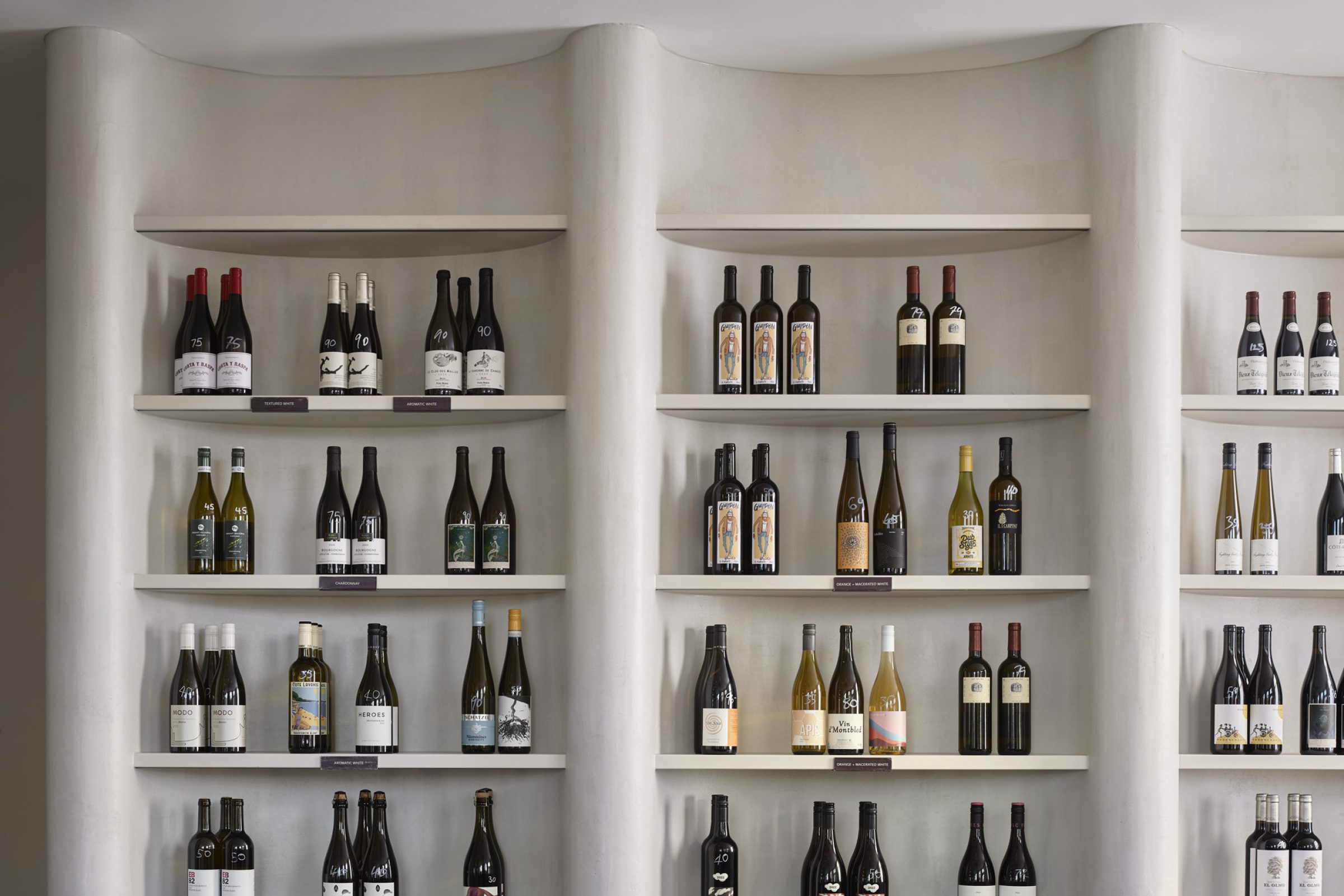 Shelves displaying a curated selection of wine bottles for "One Trick Pony".