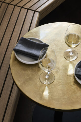 "Elegant table setup with wine glasses and napkins from One Trick Pony."