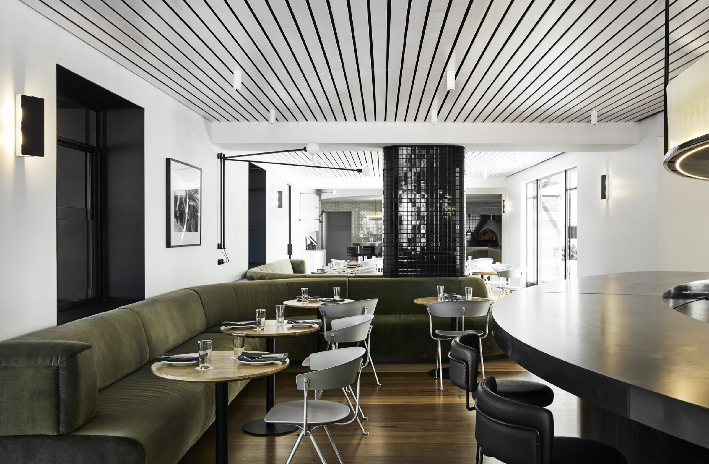 Modern dining room with sleek decor and green seating in Prince Dining Room.